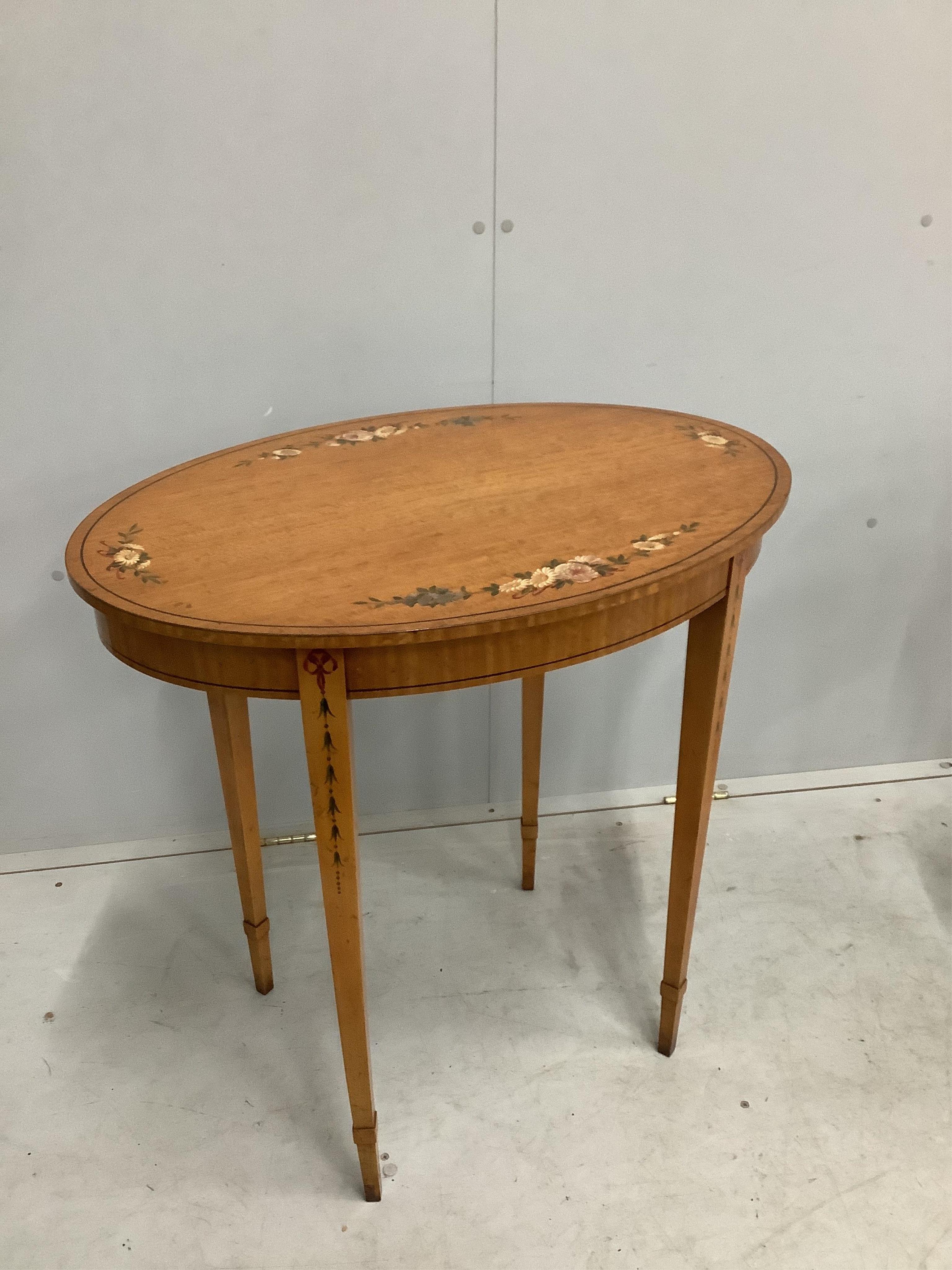 A pair of reproduction Sheraton style painted oval satinwood occasional tables, width 74cm, depth 52cm, height 74cm. Condition - good